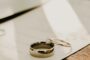 Adding spouse to mortgage - wedding rings on signed document