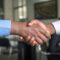 Expat mortgage broker vs bank - advisor meeting handshake