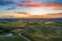 Expat mortgage Italy - Tuscany countryside hills at sunset