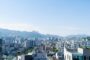 Expat mortgage South Korea - Seoul city skyline with mountains