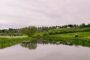 Flood risk mortgage - river running through green UK countryside