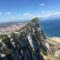 View of Gibraltar Rock and the city skyline from above, showing the Mediterranean coastline