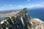View of Gibraltar Rock and the city skyline from above, showing the Mediterranean coastline