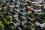 Building first property portfolio UK - aerial view suburban houses
