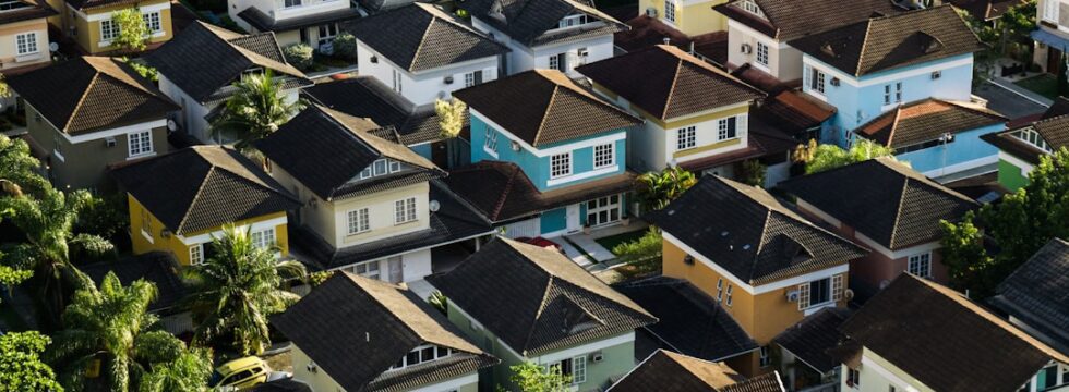 Building first property portfolio UK - aerial view suburban houses