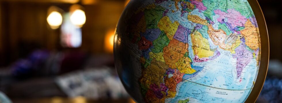 Country Guides Index UK mortgage guides by country - desk globe world map