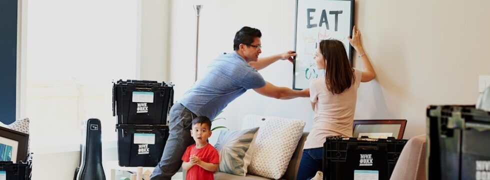 Gifted Deposit Mortgage UK Gifted deposit mortgage UK - hanging artwork in new family home