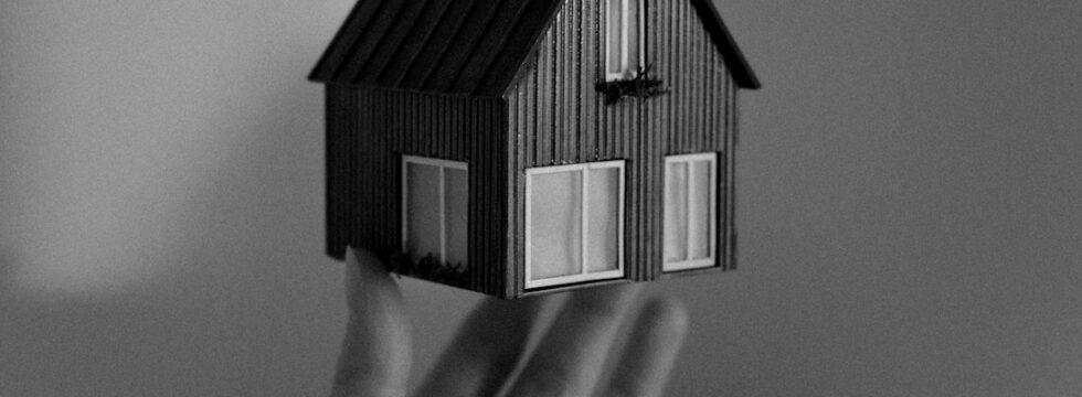 Home Insurance UK Home insurance UK - hand holding small model house