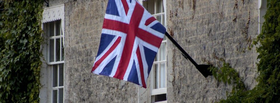 Armed Forces UK Property Buying Options Forces Help to Buy UK - Union Jack flag on stone cottage