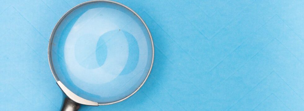 Commercial buy to let vs investment mortgages comparison - magnifying glass documents