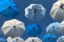 Commercial property insurance UK underinsurance - umbrella protection concept