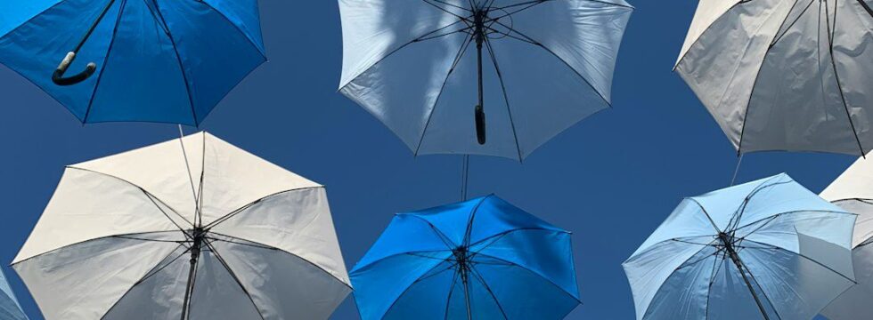 Commercial Property Insurance Underinsurance Commercial property insurance UK underinsurance - umbrella protection concept