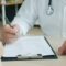 Critical illness cover conditions list UK - clipboard medical consultation