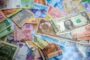 Currency risk expat mortgage UK - international banknotes