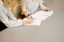 EMI share options loan collateral UK - employee contract paperwork signing