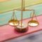 Income protection vs critical illness cover UK - balance scale comparison