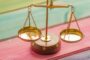 Income protection vs critical illness cover UK - balance scale comparison