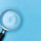 Regulated vs unregulated bridging UK - magnifying glass reviewing documents