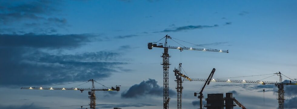 UK Development Finance hub - construction cranes on building site